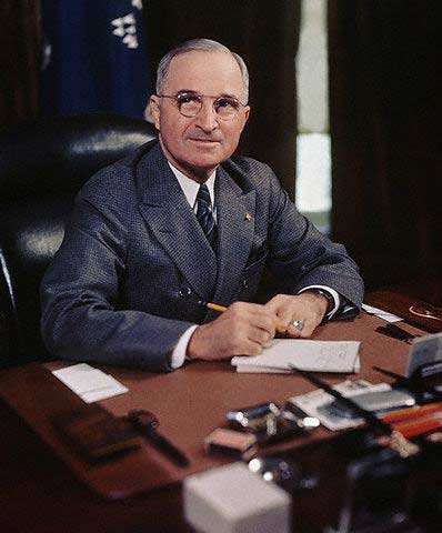 Harry S. Truman at Desk Holding Pencil